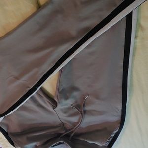 ASOS Active pants. Grey straight legs. Black white stripes on the side. Size Med